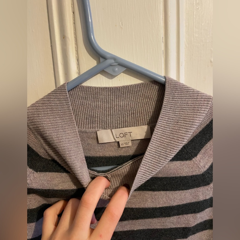 Striped sweater with a high neck
